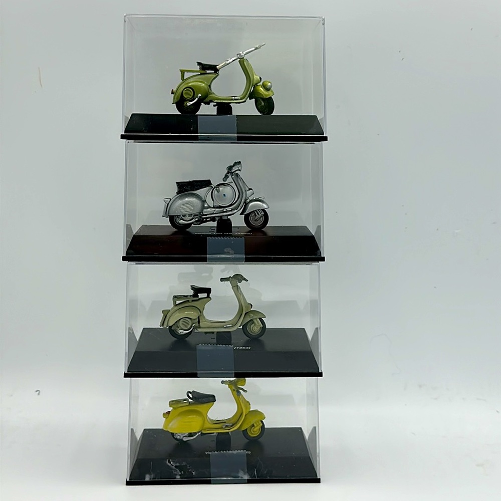 4 Collectible miniature Vespa’s. (SKU 221)